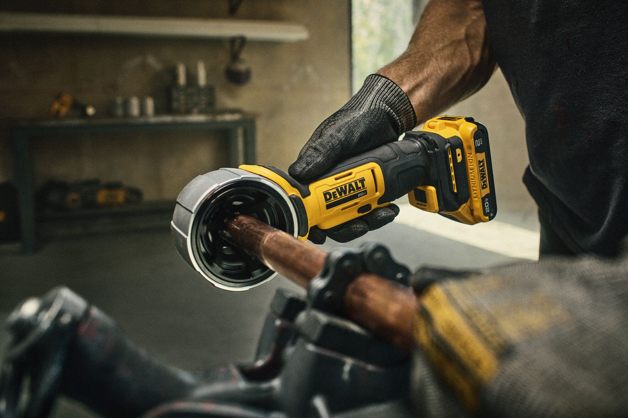 DEWALT Deburing Tool being used on copper pipe on a jobsite. 
