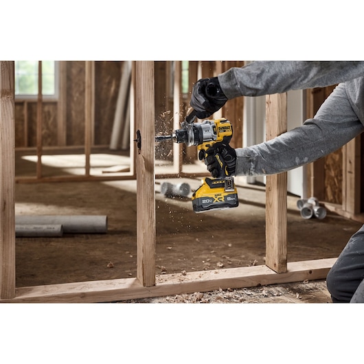 20V MAX* XR® Brushless Cordless 1/2 in. Hammer Drill drilling 2-9/16" hole for plumbing 