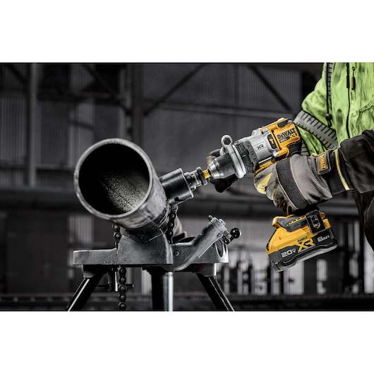 20V MAX* XR® Brushless Cordless 1/2 in. Hammer Drill drilling into pipe